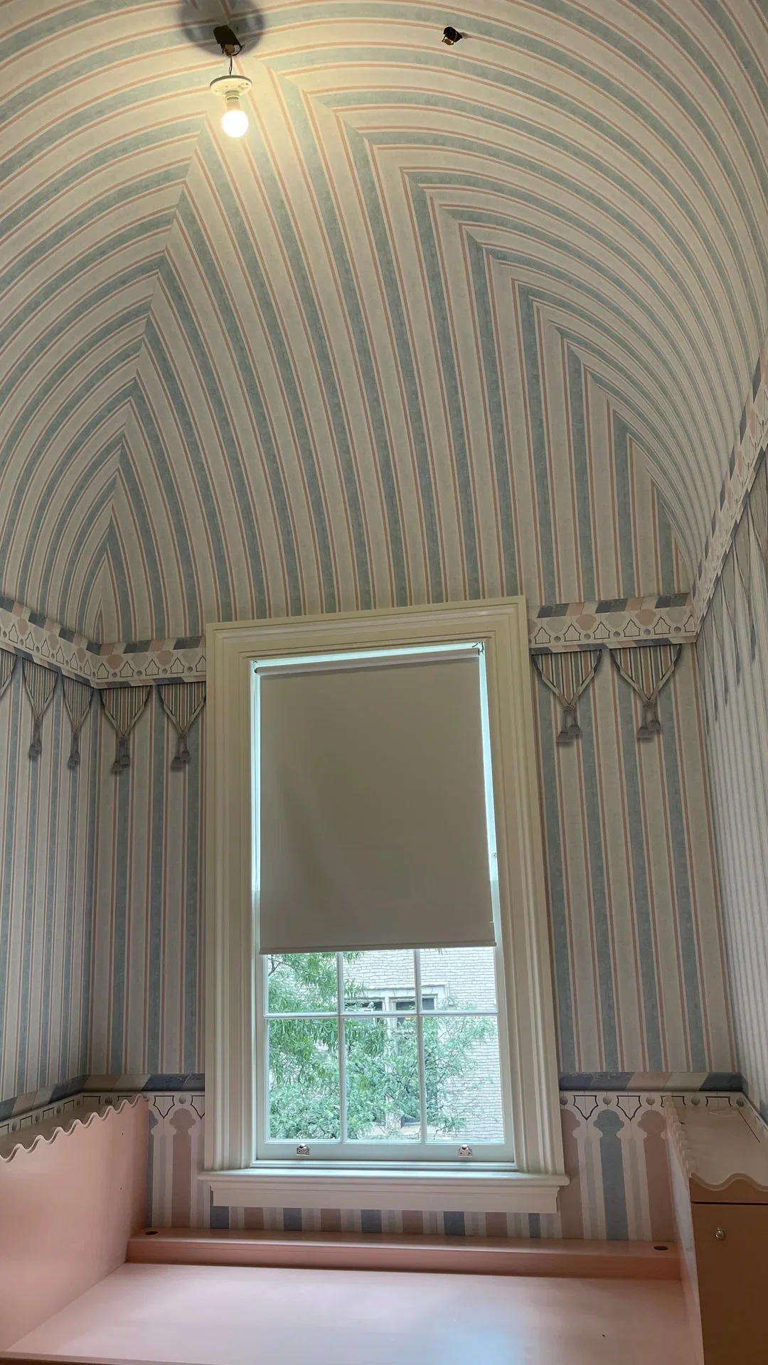 Close-up wallpaper installer scene with wallcovering