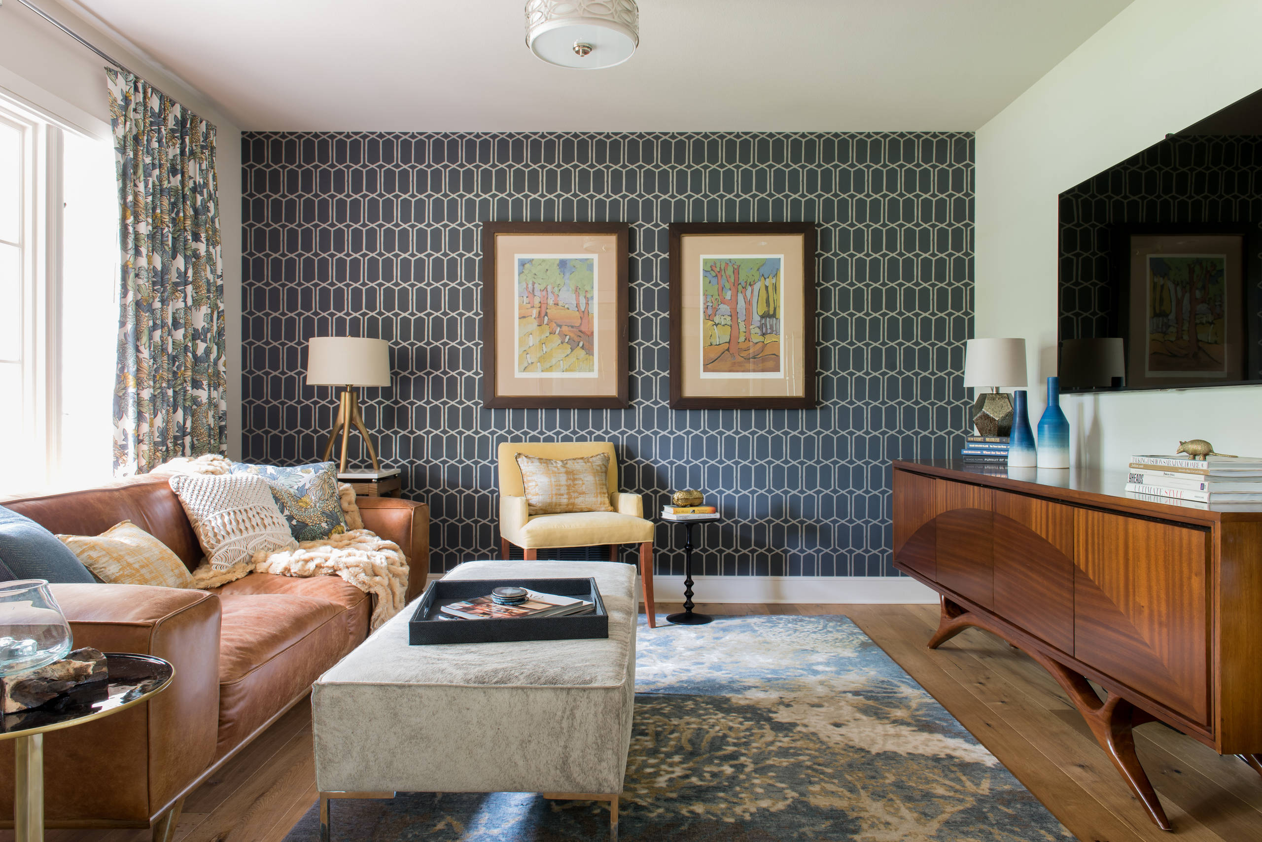 Wallpapered living room with a professionally finished feature wall